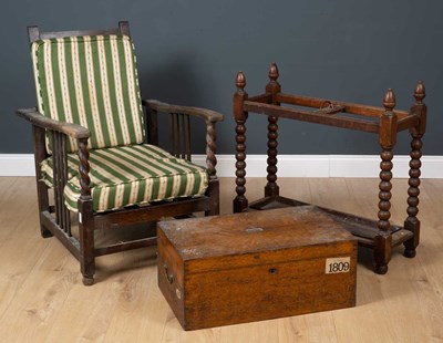 Lot 212 - An oak stick stand on barley turn supports...