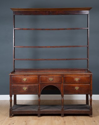 Lot 377 - An 18th century oak dresser, the three tier...