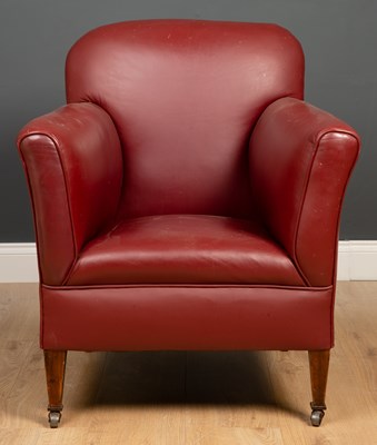 Lot 292 - A small sized red leather upholstered armchair...