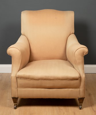 Lot 152 - A cream upholstered armchair, with short...