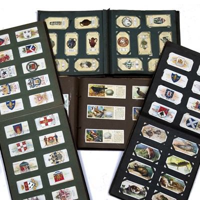 Lot 529 - A collection of fourteen cigarette card albums...