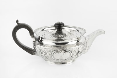 Lot 688 - A George III silver tea pot, of compressed...