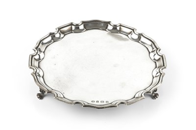 Lot 691 - A silver small salver, with shaped piecrust...