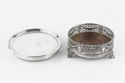 Lot 692 - A George III silver bottle coaster, the...