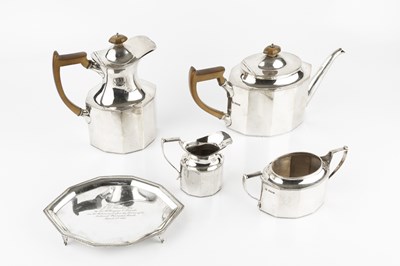 Lot 694 - A silver five piece tea service, of faceted...