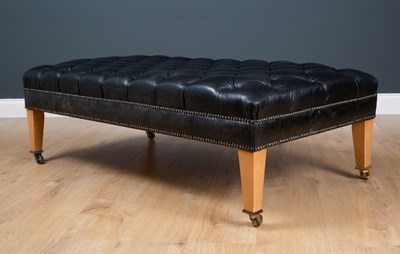 Lot 414 - A contemporary rectangular low black leather...