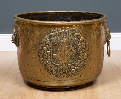 Lot 283 - A 19th century brass log bin with embossed...