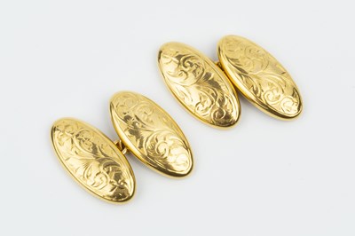 Lot 24 - A pair of 9ct gold cufflinks, each oval panel...