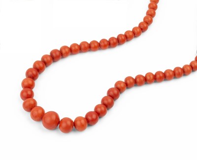 Lot 26 - Two coral bead necklaces, the first comprising...