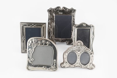 Lot 713 - A modern silver easel photo frame, embossed...