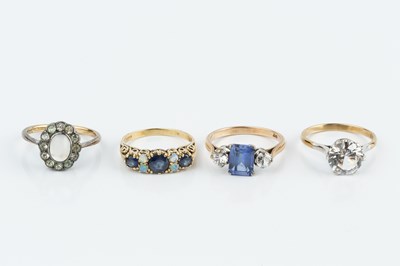 Lot 117 - A sapphire and opal half hoop ring,...