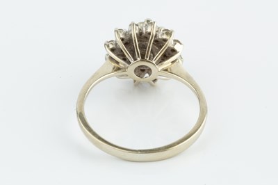 Lot 228 - A diamond cluster ring, the principal round...