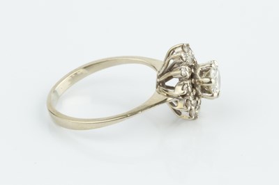 Lot 228 - A diamond cluster ring, the principal round...