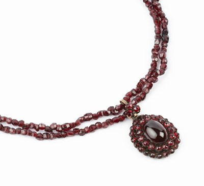 Lot 70 - A garnet cluster pendant necklace, the cluster...