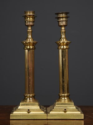 Lot 296 - A pair of brass table lamps, the fluted column...