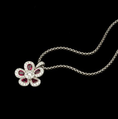 Lot 155 - A ruby and diamond cluster pendant on chain,...