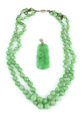 Lot 170 - A jade bead necklace with diamond set clasp,...