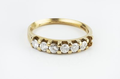 Lot 189 - A diamond half hoop ring, the uniform round...