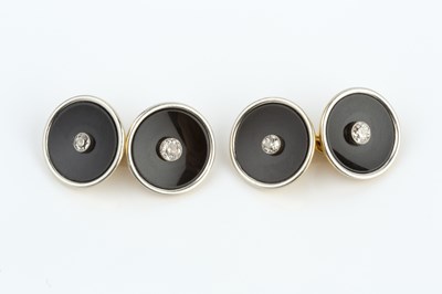 Lot 249 - A pair of onyx and diamond cufflinks, each...