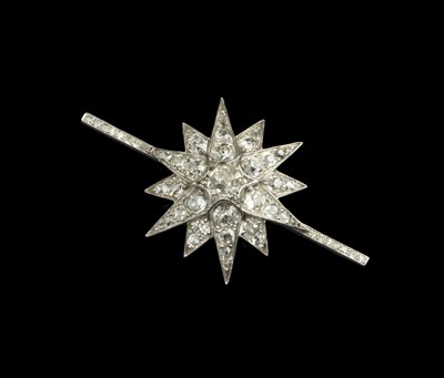 Lot 236 - A diamond star brooch, highlighted with...