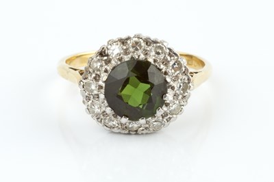 Lot 263 - A green tourmaline and diamond cluster ring,...