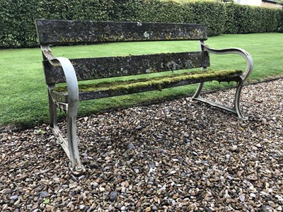 Lot 511 - An old garden bench with painted cast iron...