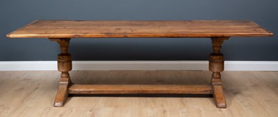 Lot 199 - A large oak refectory table, with cleated ends...