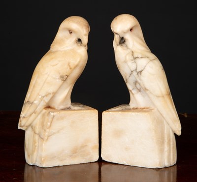 Lot 128 - A pair of carved alabaster parrot bookends...