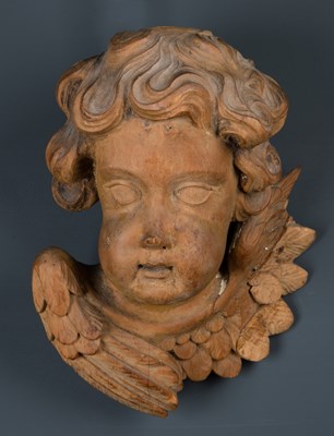 Lot 129 - After Grinling Gibbons, a limewood carved head...