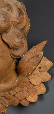 Lot 129 - After Grinling Gibbons, a limewood carved head...