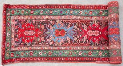 Lot 666 - A mid 20th century Eastern polychrome woollen...