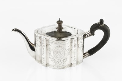 Lot 766 - A George III silver teapot, of shaped oval...