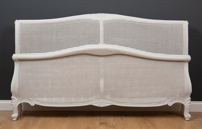 Lot 284 - A modern white painted French style king size...