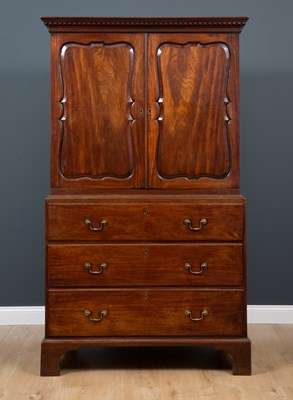 Lot 3 - A George III mahogany press cupboard with...