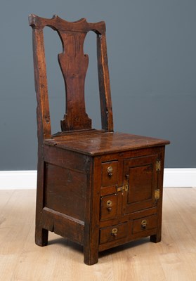 Lot 45 - A George III Irish oak country chair possibly...