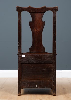 Lot 45 - A George III Irish oak country chair possibly...