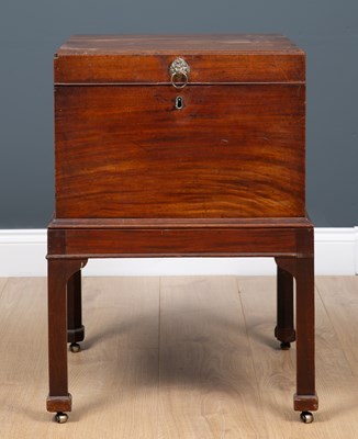 Lot 41 - A George III mahogany cellarette with lion...