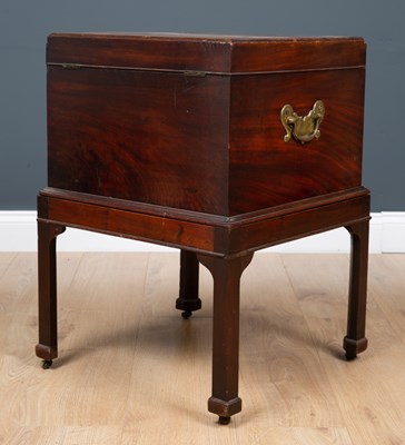 Lot 41 - A George III mahogany cellarette with lion...