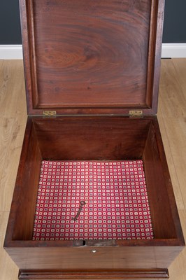 Lot 41 - A George III mahogany cellarette with lion...