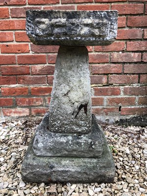 Lot 536 - A square concrete bird bath with moulded edges...