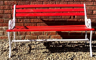 Lot 538 - A red painted wooden and cast iron garden...