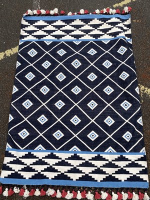 Lot 261 - A tribal flat weave rug with black and white...