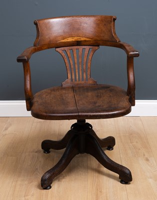 Lot 127 - An Edwardian oak swivel desk chair with open...