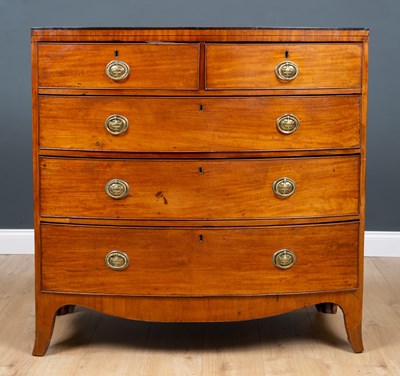 Lot 215 - A George III mahogany bowfronted chest with...