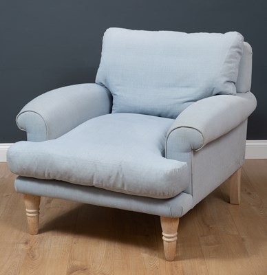 Lot 309 - A deep light blue upholstered armchair...