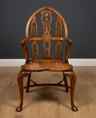 Lot 395 - A Gothic style yew wood Windsor armchair...