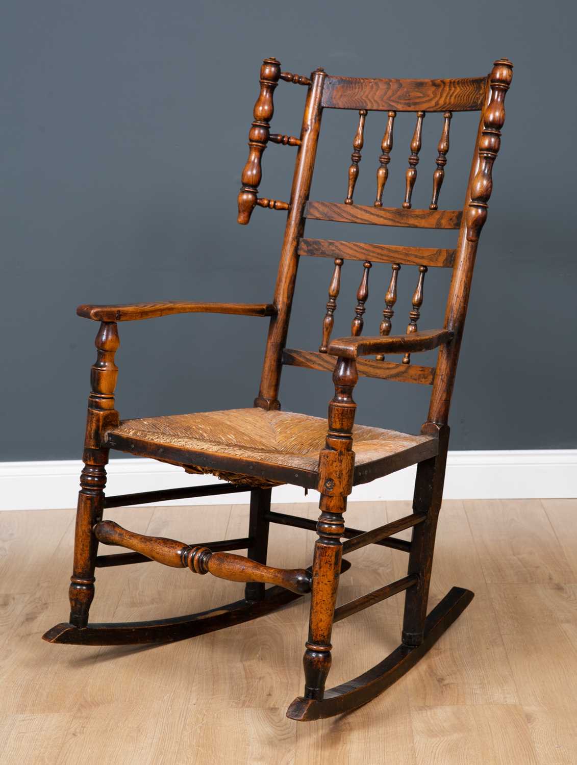 Lot 64 - A Lancashire elm spindle back rocking chair