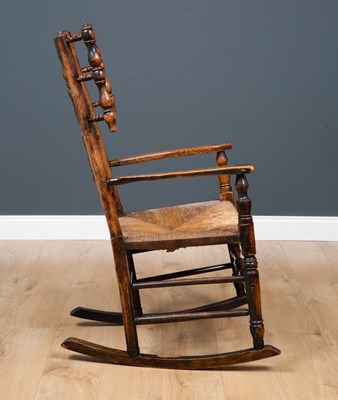 Lot 64 - A Lancashire elm spindle back rocking chair...