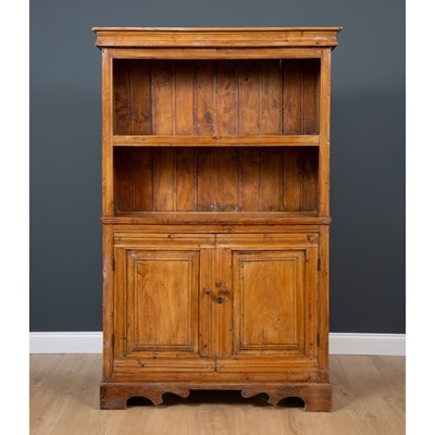 Lot 394 - A French provincial elm cupboard with open...