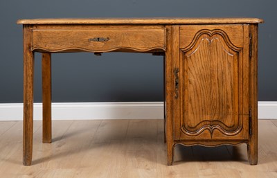 Lot 396 - A French oak desk with single drawer and...